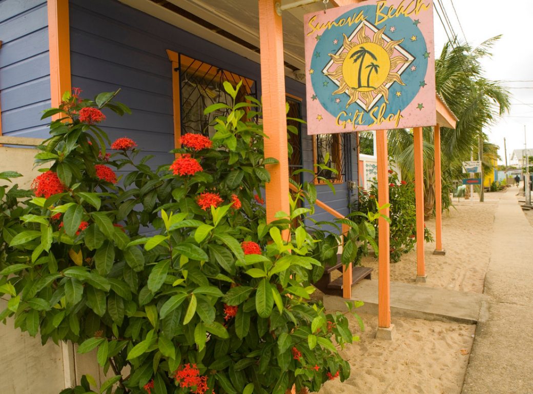 B08KJK Beach shop with colorful sign, Placencia, Stann Creek District, Belize, Central America