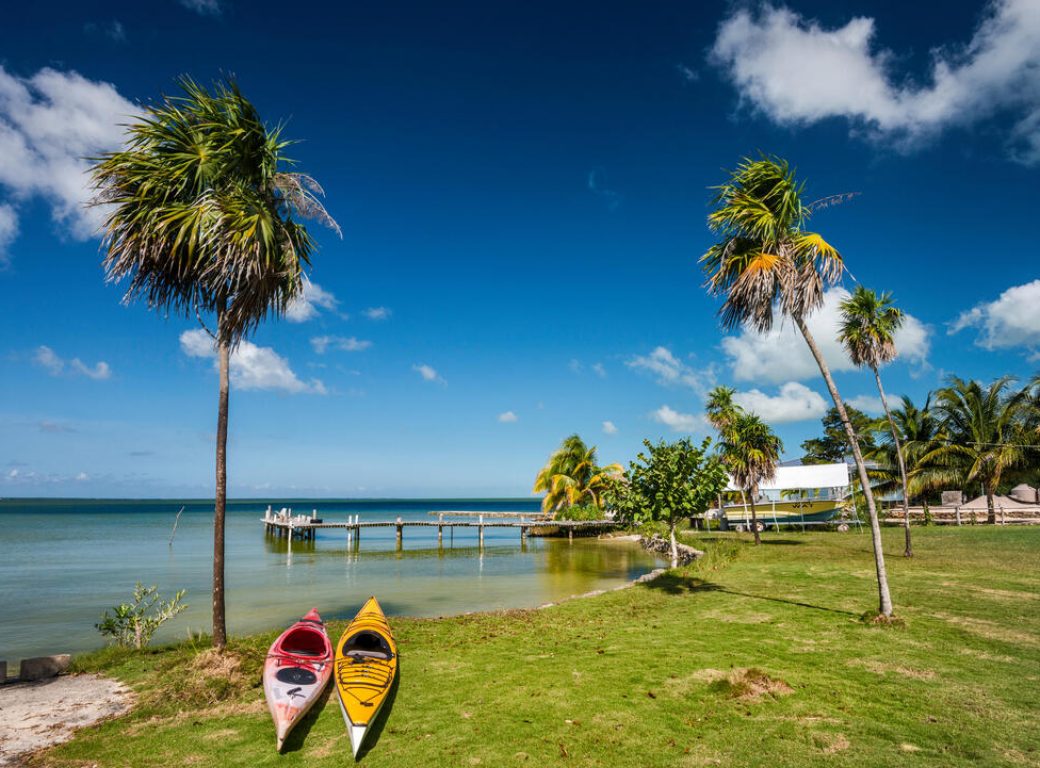 RB803P Kayaks at Corozal Bay seashore, Caribbean Sea coast, Cerros Beach Resort, Cerros Peninsula, Corozal District, Belize, Central America