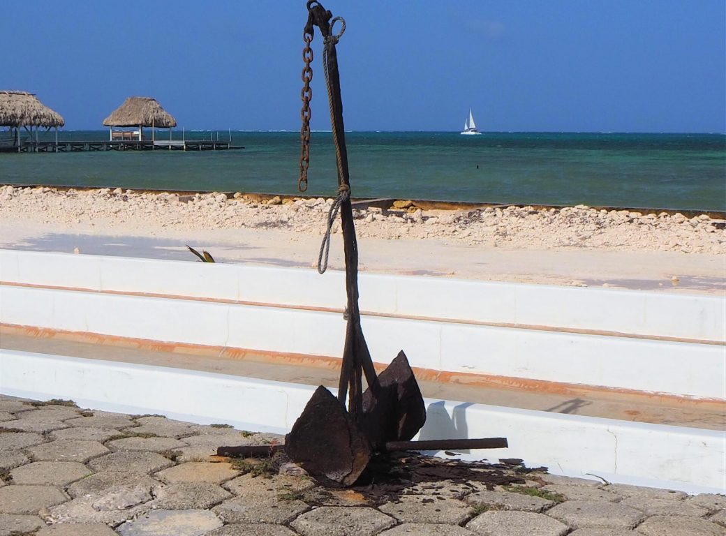 W4EYEY Anchor on the beach in Ambergris Caye, Belize tropical caribbean.